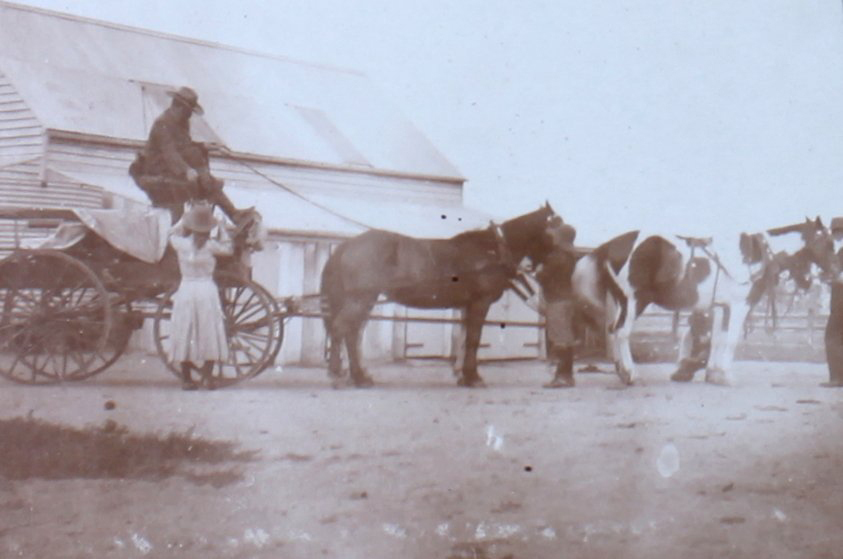 Unidentified man on a wagon harnassed to four horses