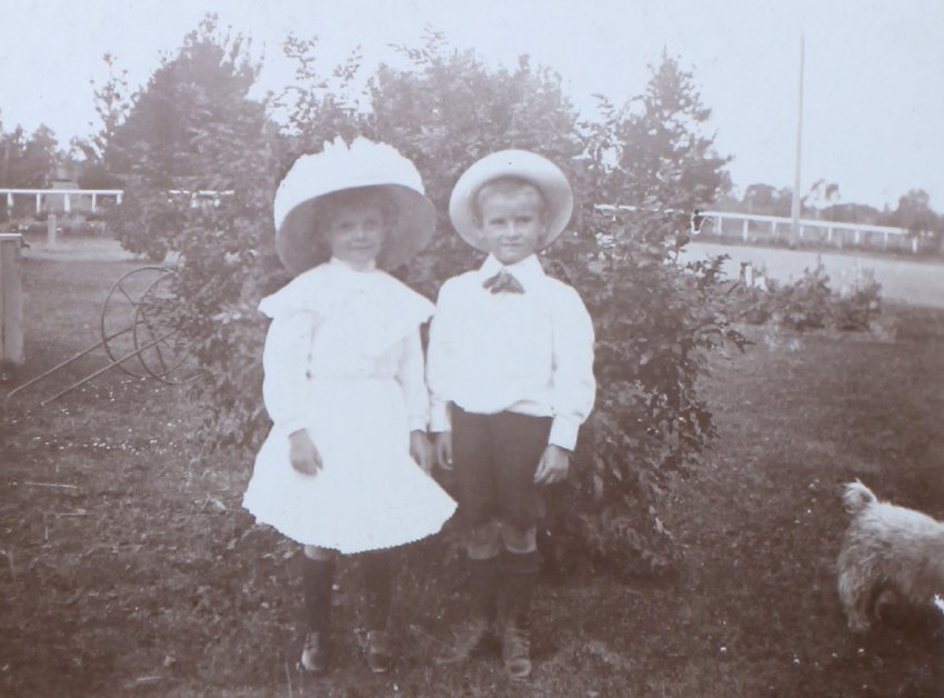 Two unidentified children in the garden