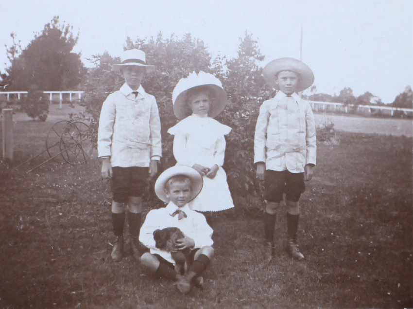 Four unidentified children in the garden
