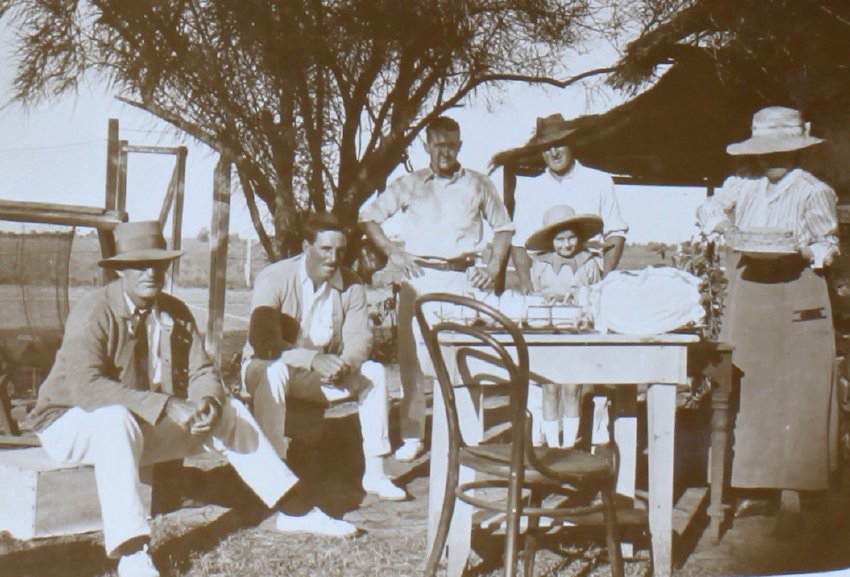 Unidentified group at tennis having tea