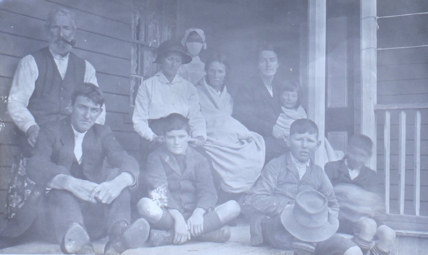 Unidentified group of men, women and children