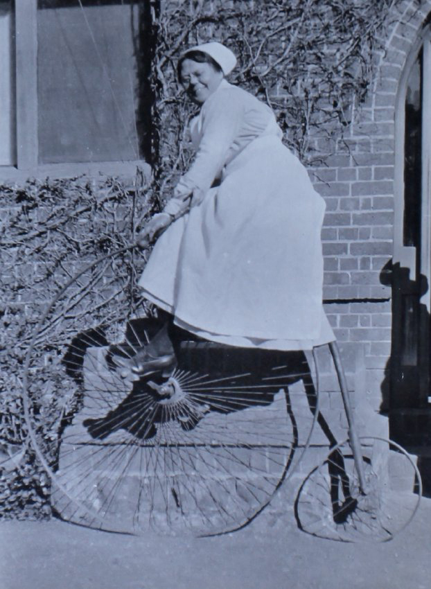 Unidentified woman on a penny farthing bicycle