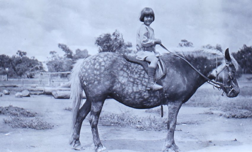 Unidentified young girl on a horse