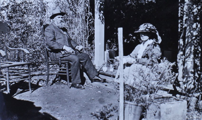 Unidentified man and woman sitting