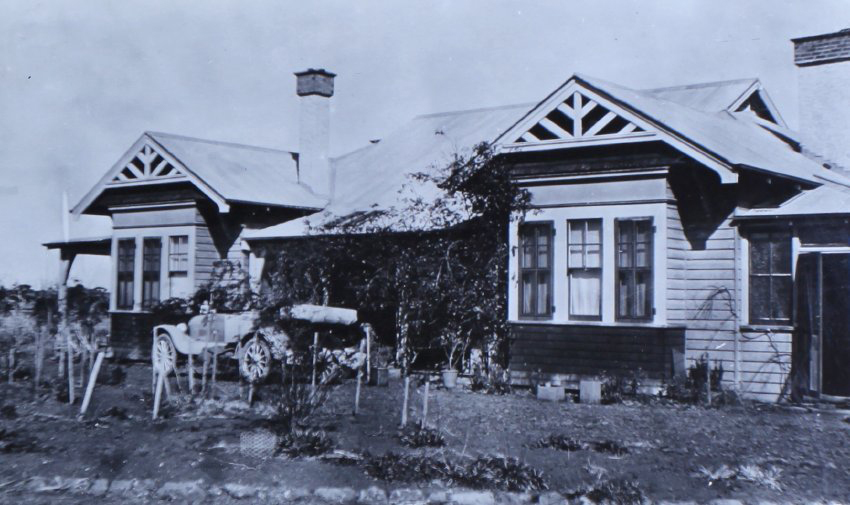 Unidentified house with a car in front