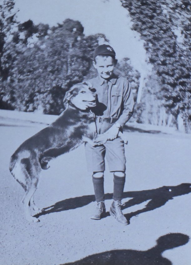 Young boy with a pet dog