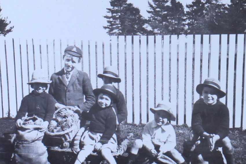 Group of children with sacks of pine cones