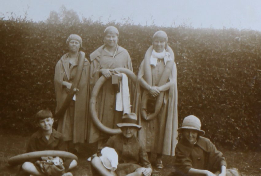 Three women and three children in swimming gear