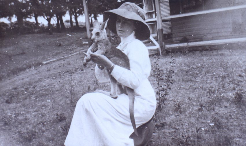 Woman holding a young kangaroo