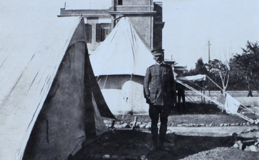 Officer outside a tent