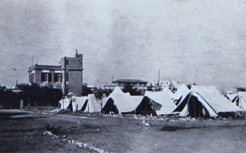 Army bivouac near permanent buildings
