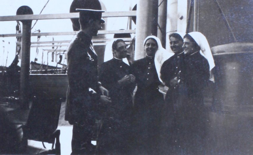 An officer and four nurses onboard a ship