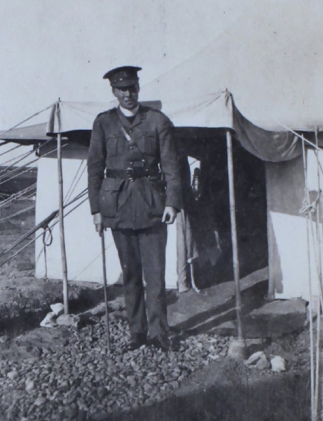 A chaplain outside a tent