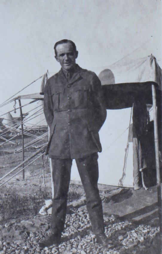 A soldier outside a tent