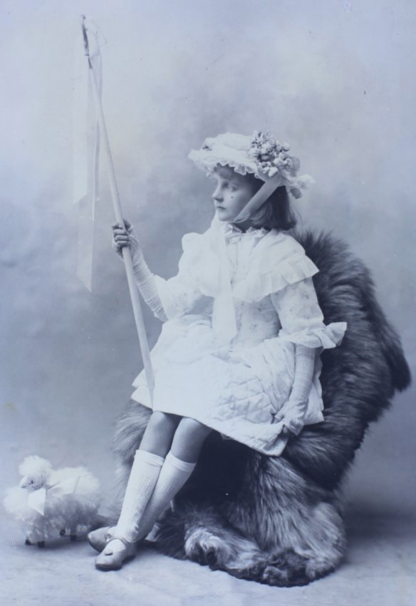 Girl sitting on a chair with a flag