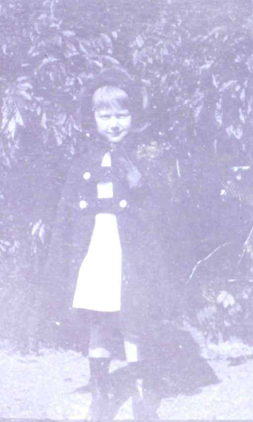 Young girl standing in the garden