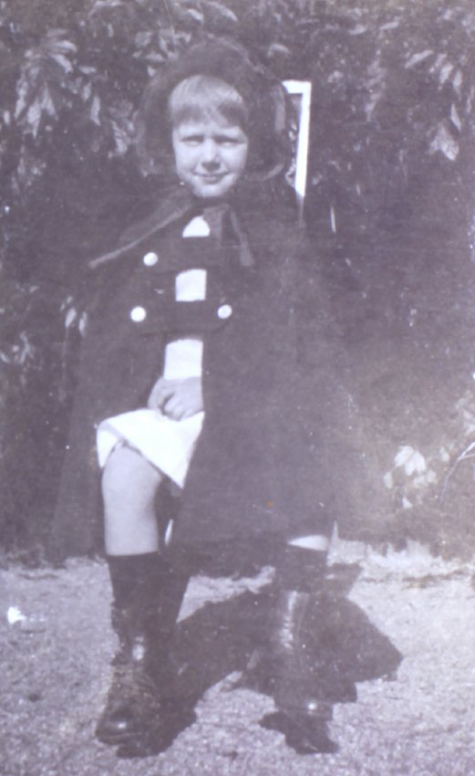 Young girl sitting on a chair in the garden