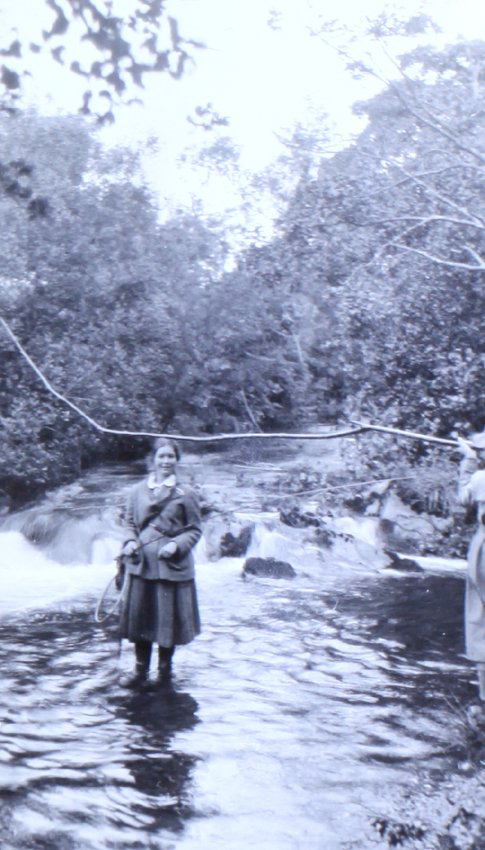 Two women fishing - standing in water