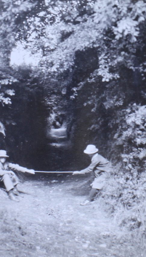 Two children playing on a pathway