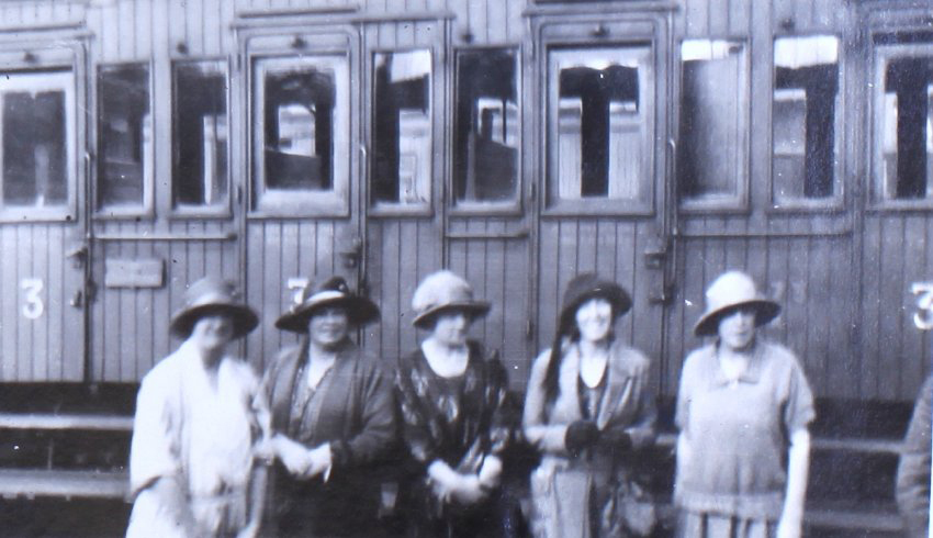 "Farewell" Group of women in front of a train