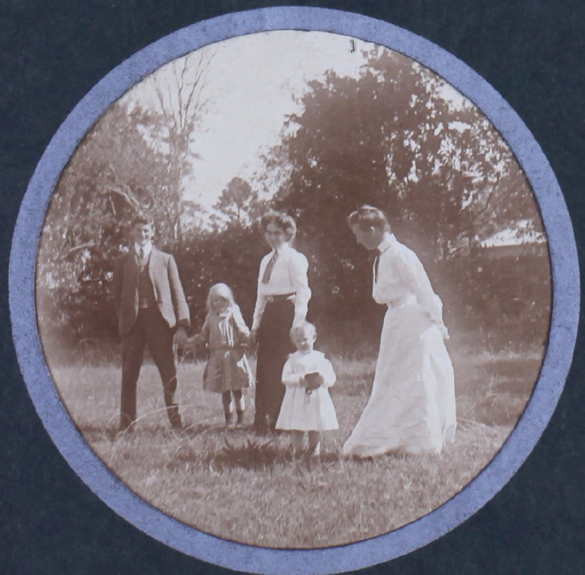 Unidentified man, two women and two young girls