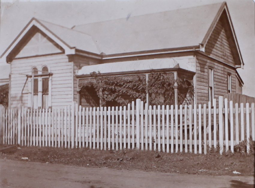 Small house with picket fence