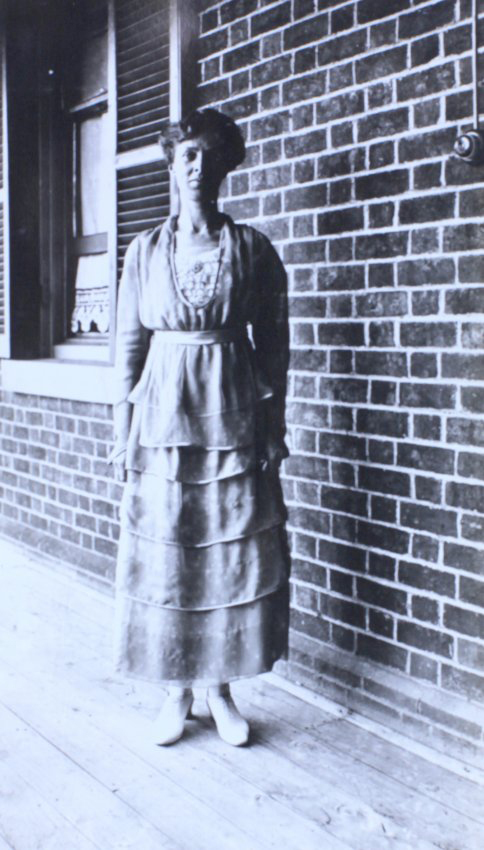 Woman standing on the verandah