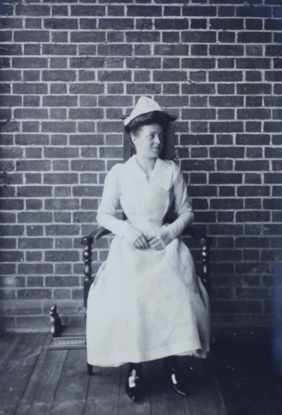 Woman sitting in a chair on the verandah