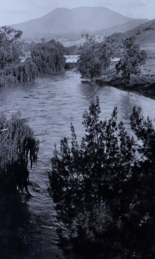 View down a river to a bridge