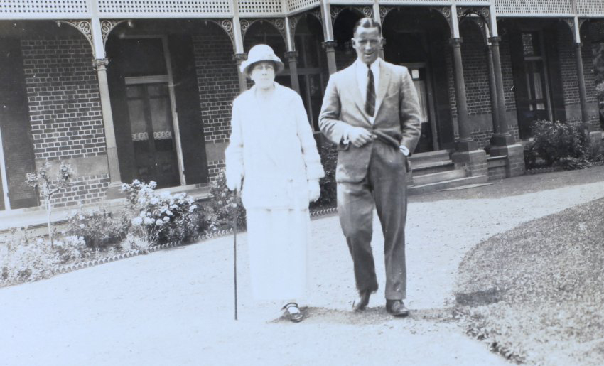 Unidentified man and woman standing in front of Saumarez Homestead