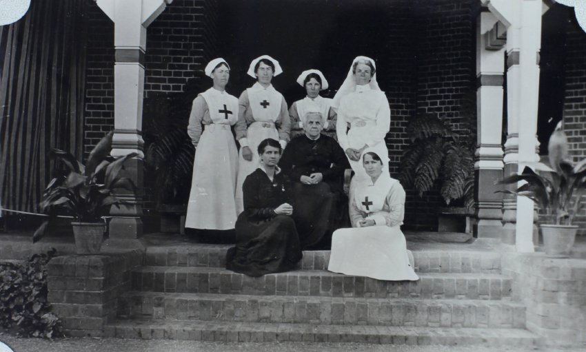Group of nurses sitting on the steps