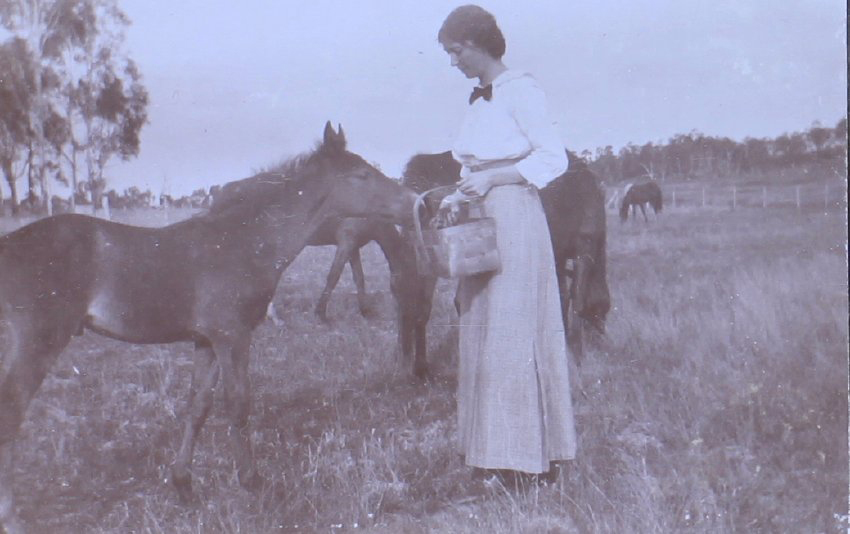 Unidentified woman with a foal