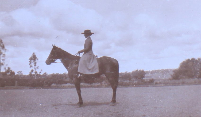 Unidentified woman on horseback