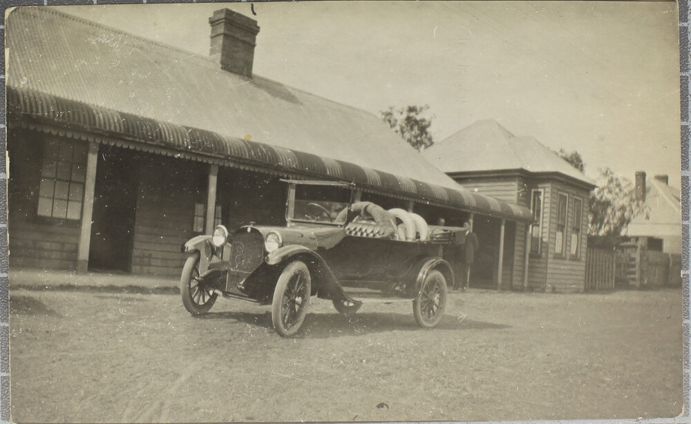Motorcar outside country hotel