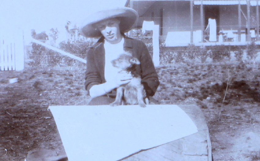 Unidentified woman with pet dog