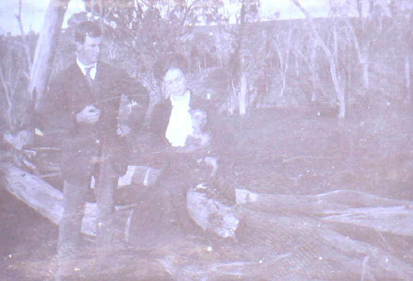 Unidentified couple with pet dog