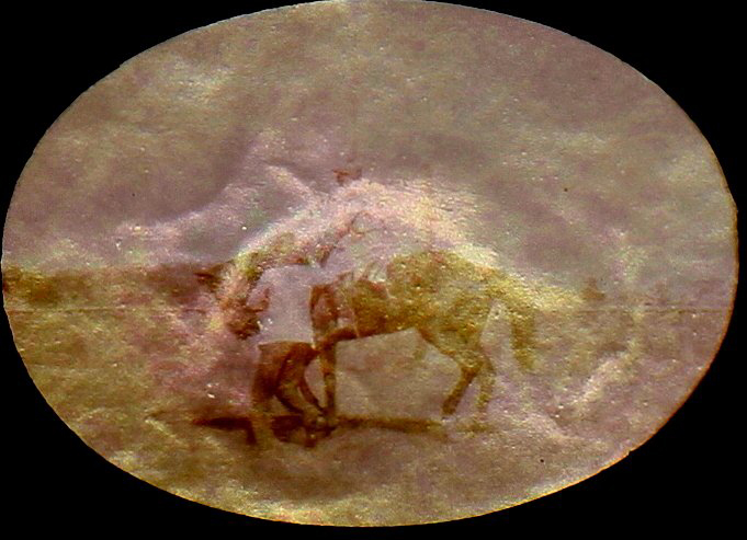 Jockey on a racehorse with a handler