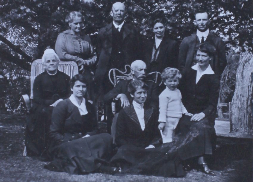 Group of unidentified men, women and a child