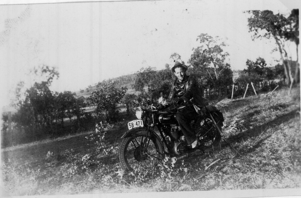 Laurie Hattersley on Triumph motorbike used to collect orders for Hanna's grocery department, c. 1935