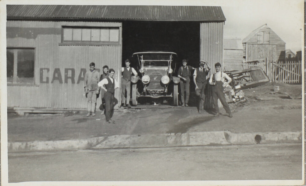 Car and men outside Whitby's Garage, Jessie Street, Armidale