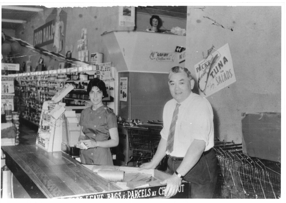 Tom Loy and unidentified shop assistant in the Food Hall in the Hong Yuen store, Inverell, c.1960 