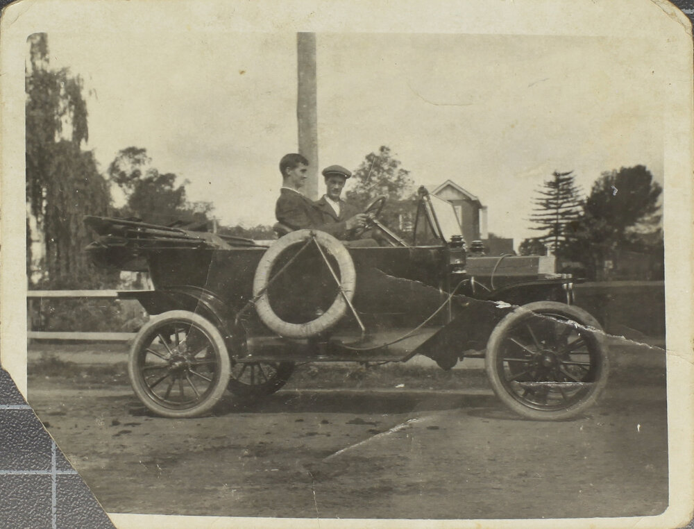 Two men in motor car