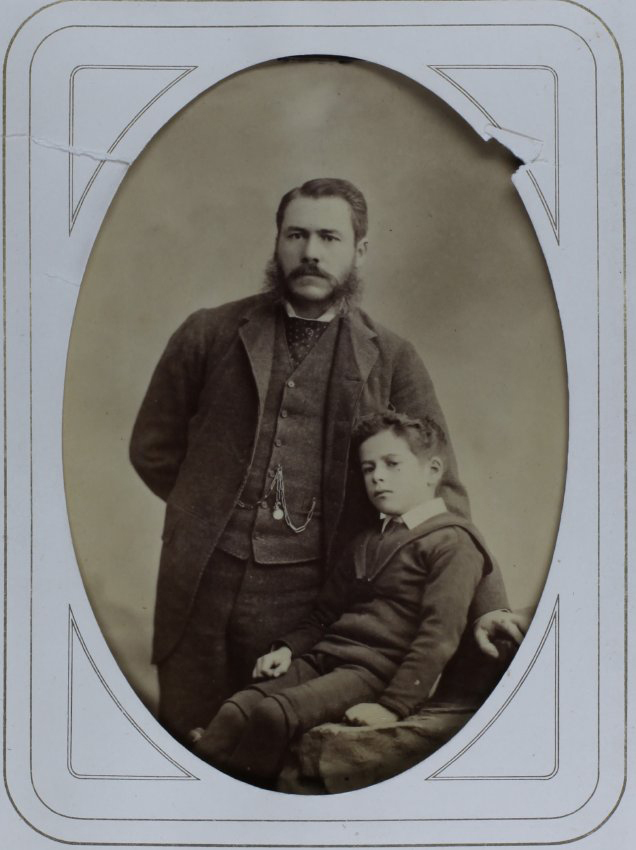 A cabinet photo of an unidentified man and boy