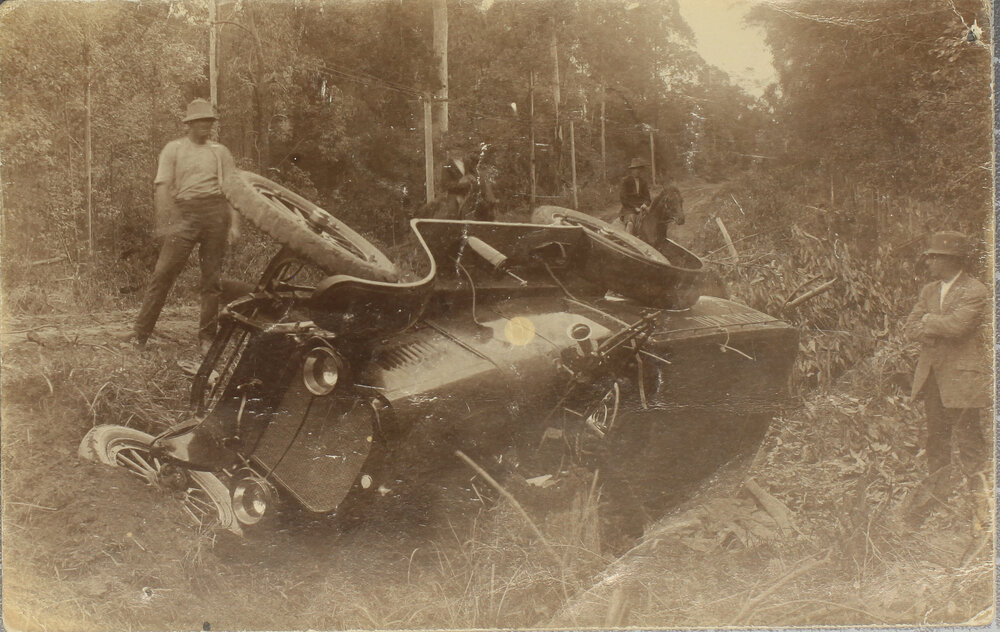 Royal Mail motor car rolled beside country road