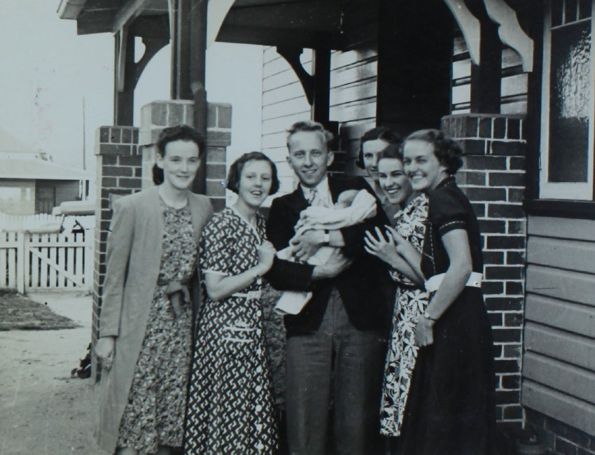 Students at Voisey house photographed with new baby Y. Voisey