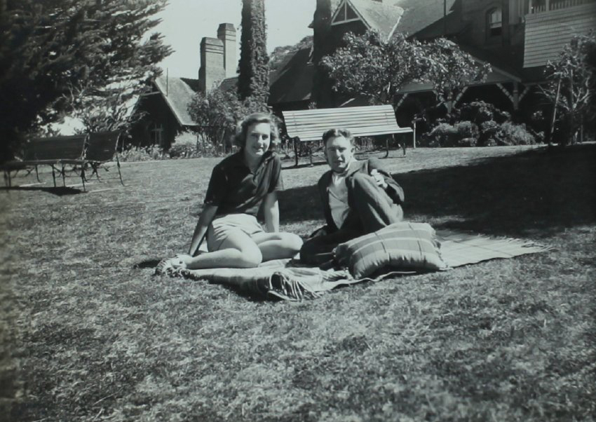 Students in the garden of Booloominbah - Betty Riley and Tom Harrigan. October 1940 NEUC