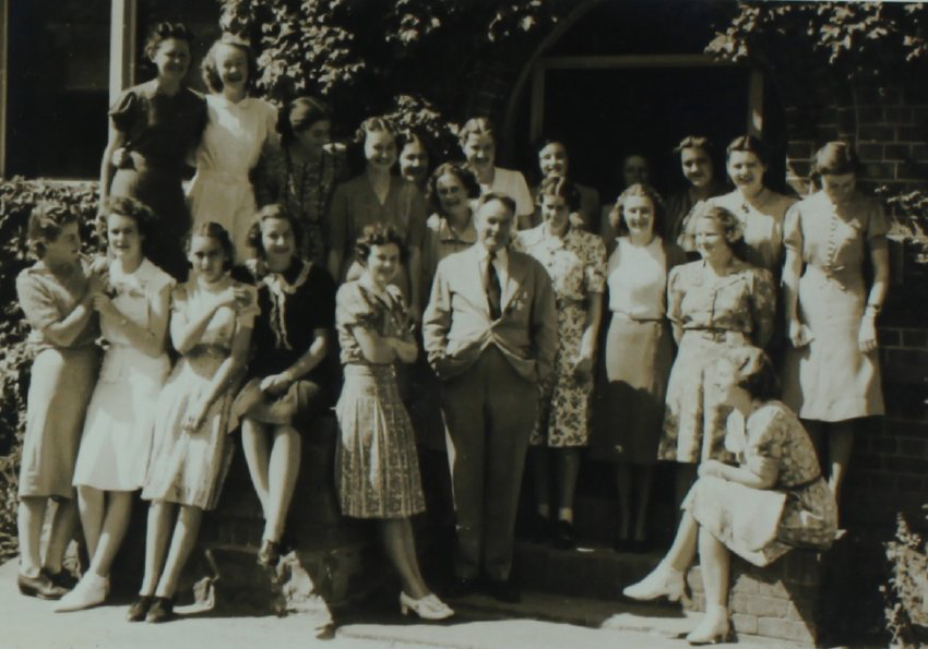 NEUC staff posing outside Booloominbah with Edgar Booth, 1940