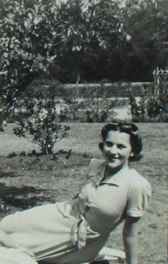 Woman sitting, Booloominbah gardens (NEUC)