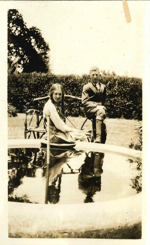 Kingsford Smith Album, A Boy and Girl in a Garden