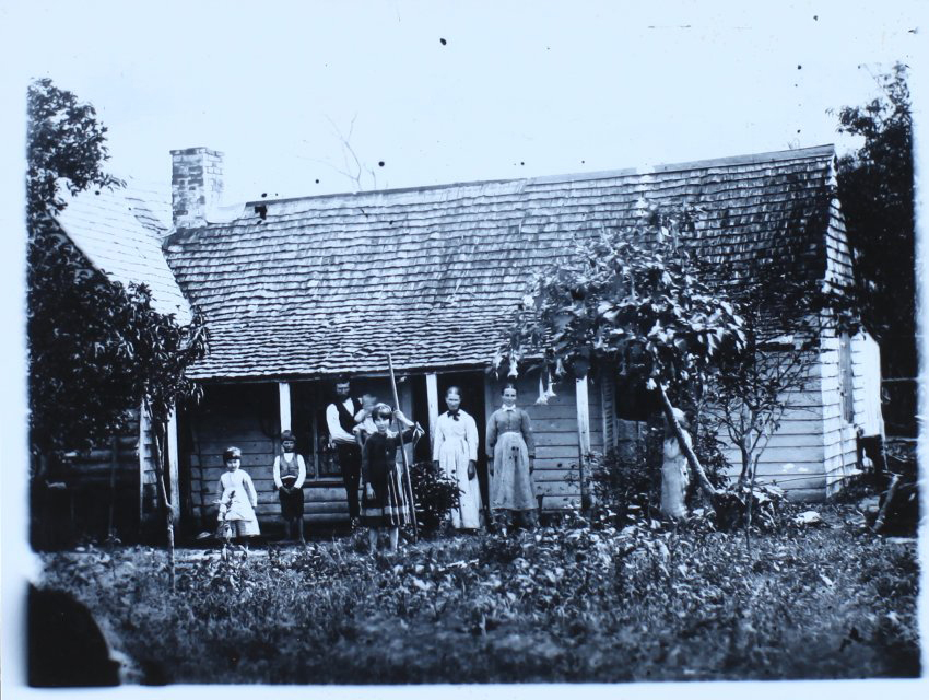 Early settler and family outside home, Casino